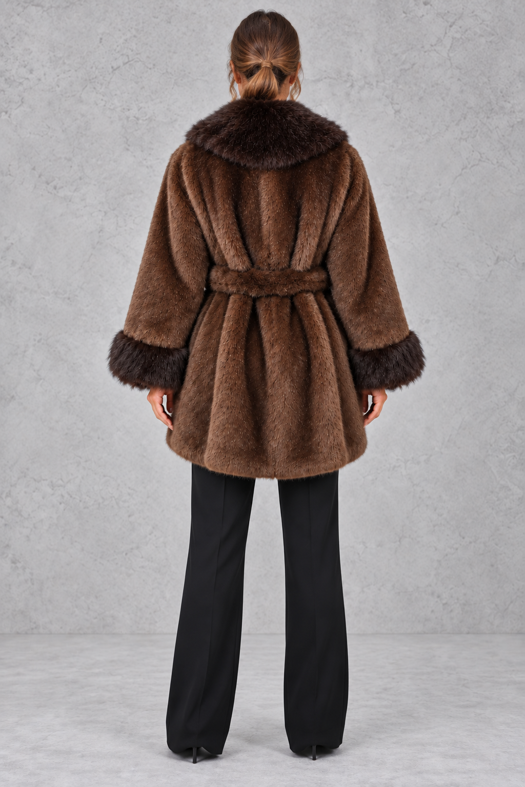 Faux fur collar wrap coat in brown styled with belt tied