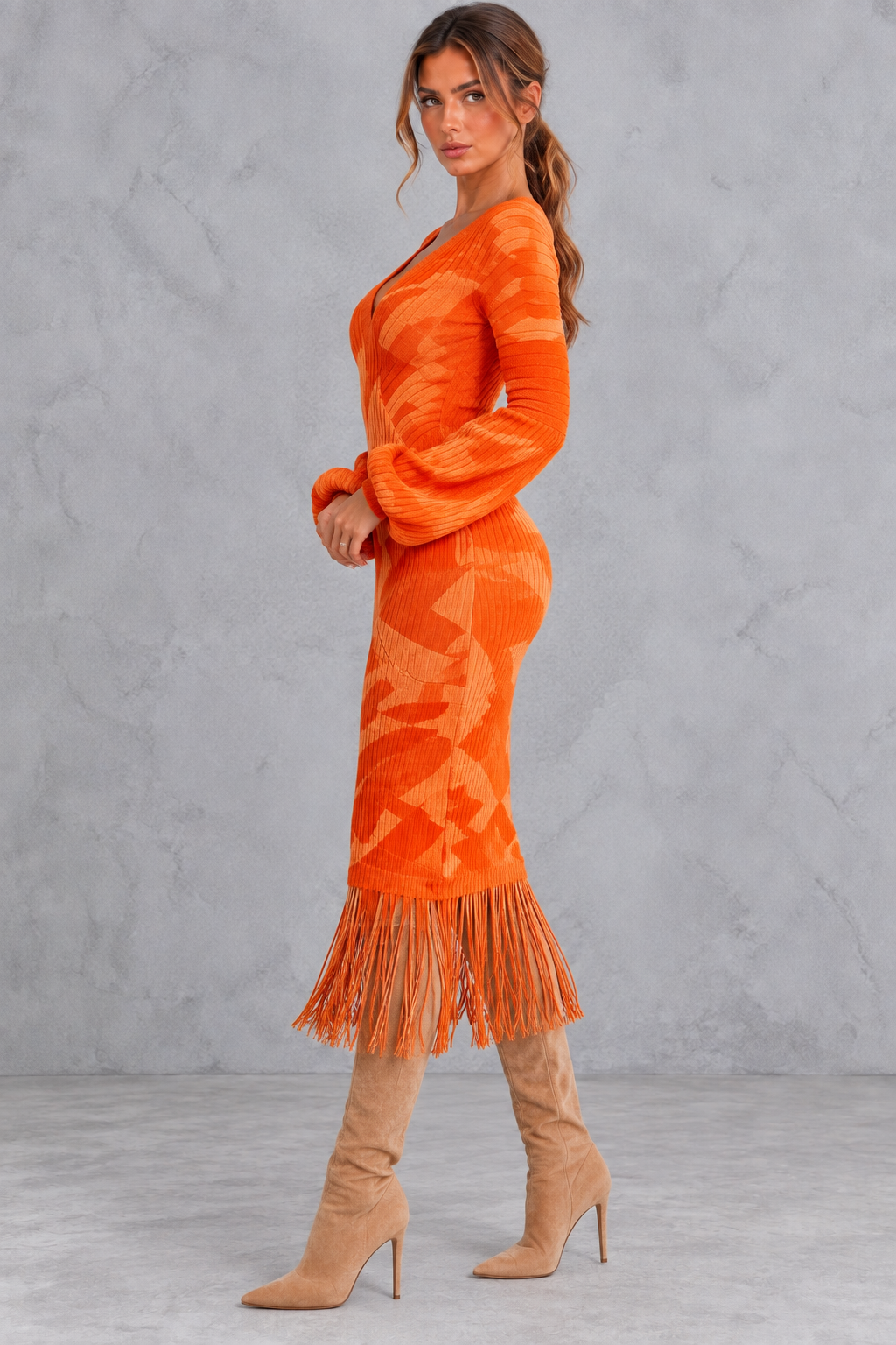 Women's fringe hem sweater dress in a leopard print