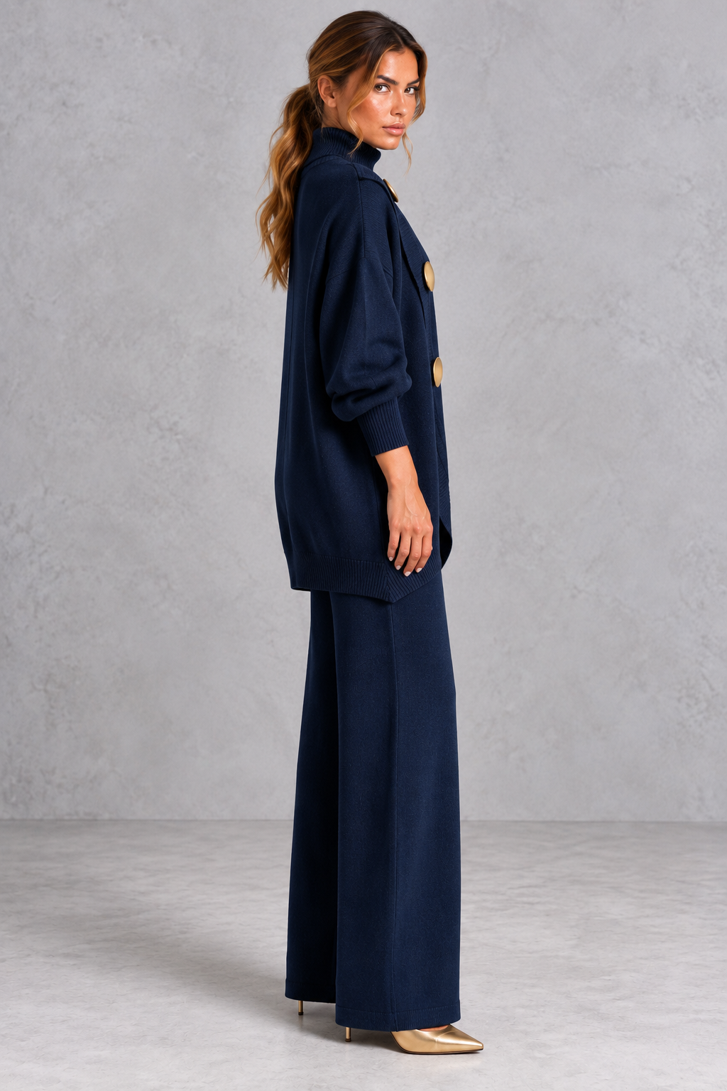 Back view of the oversized turtleneck sweater and knit pants