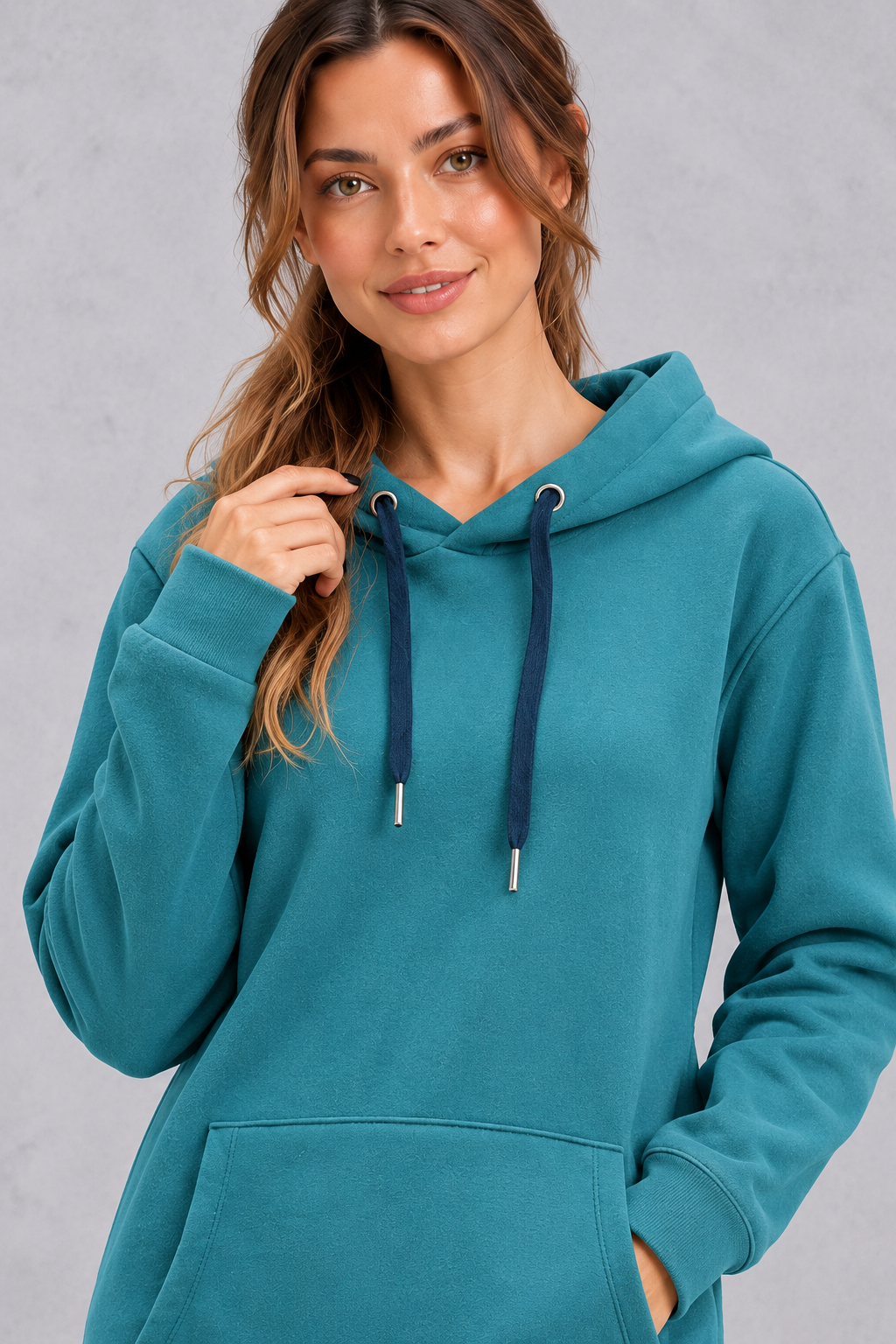 Close-up of drawstring hood with metal-tipped cords on a women's hoodie dress