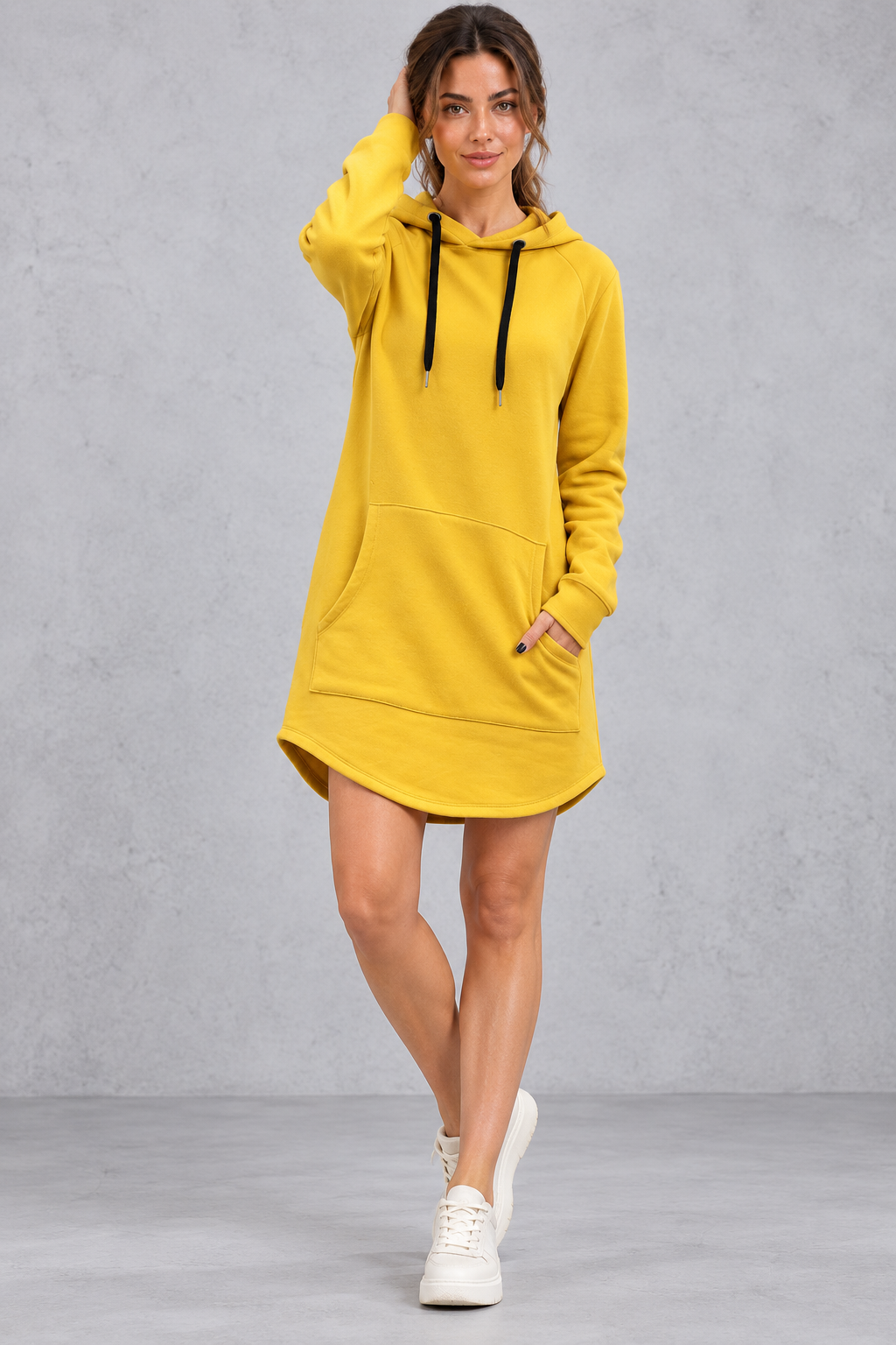 Women's relaxed fit hoodie mini dress with ribbed cuffs, side view