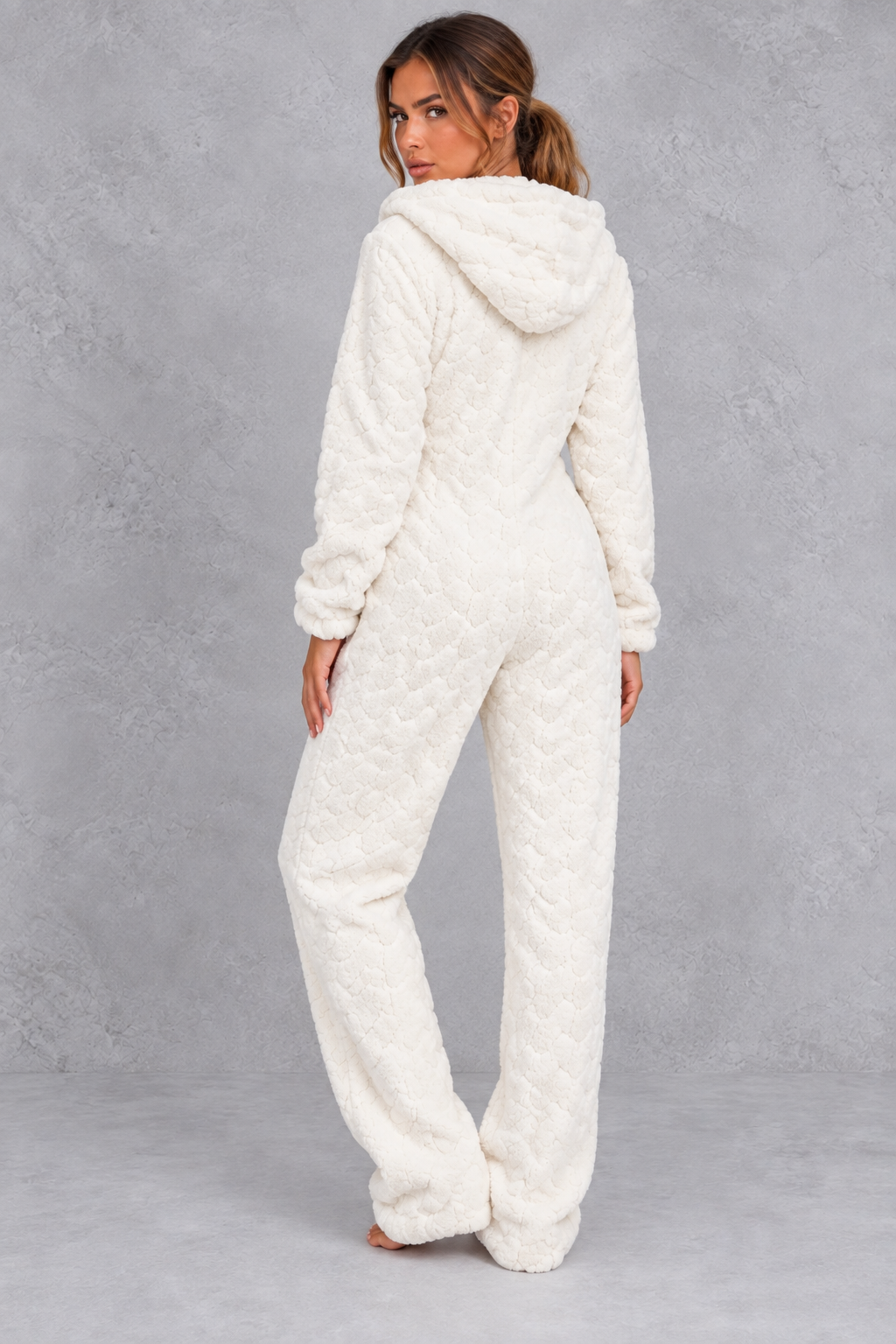 Cozy lounging look wearing the hooded fleece onesie at home