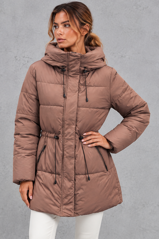 Hooded puffer jacket styled with skinny jeans and boots