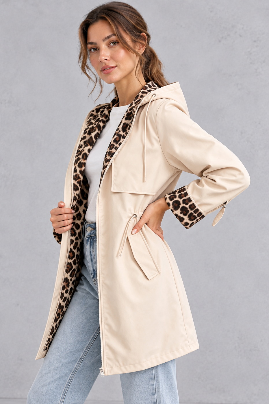 Back view of the hooded windbreaker showing the storm flap yoke