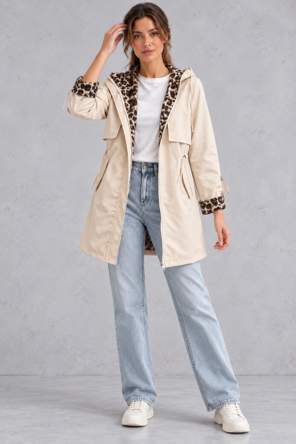 Cream hooded jacket styled with jeans for a casual spring look