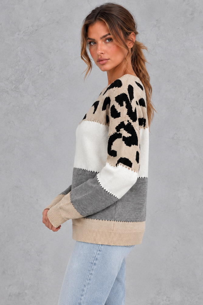 Leopard print sweater styled with jeans and boots