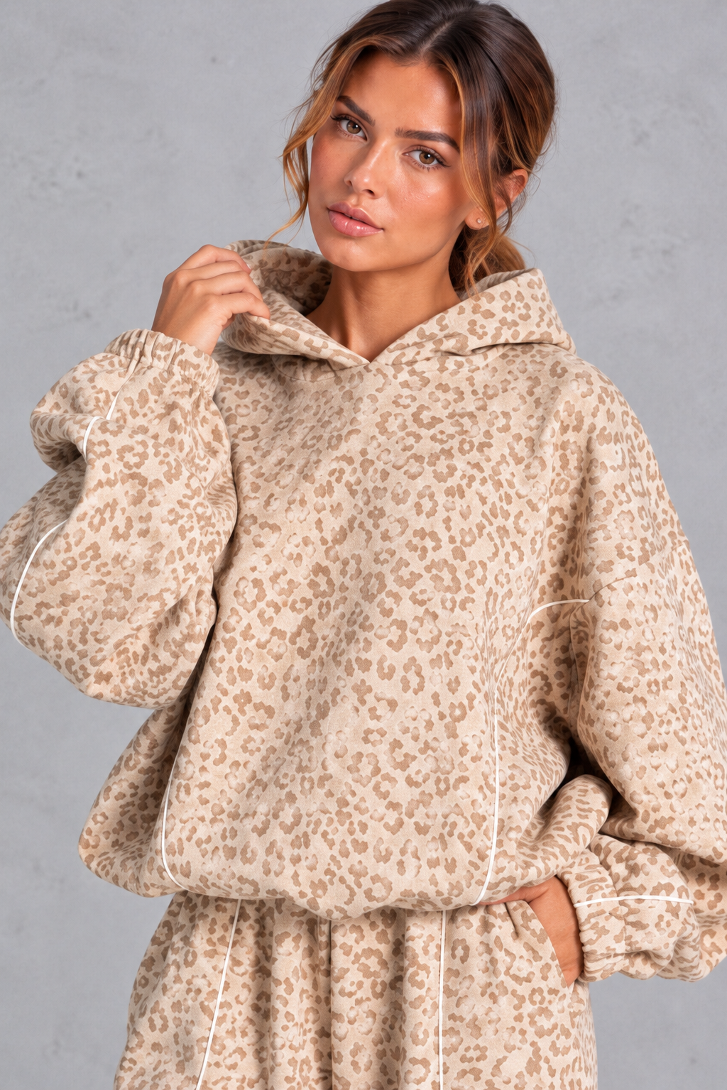 Close-up of the curved contrast piping and leopard print knit