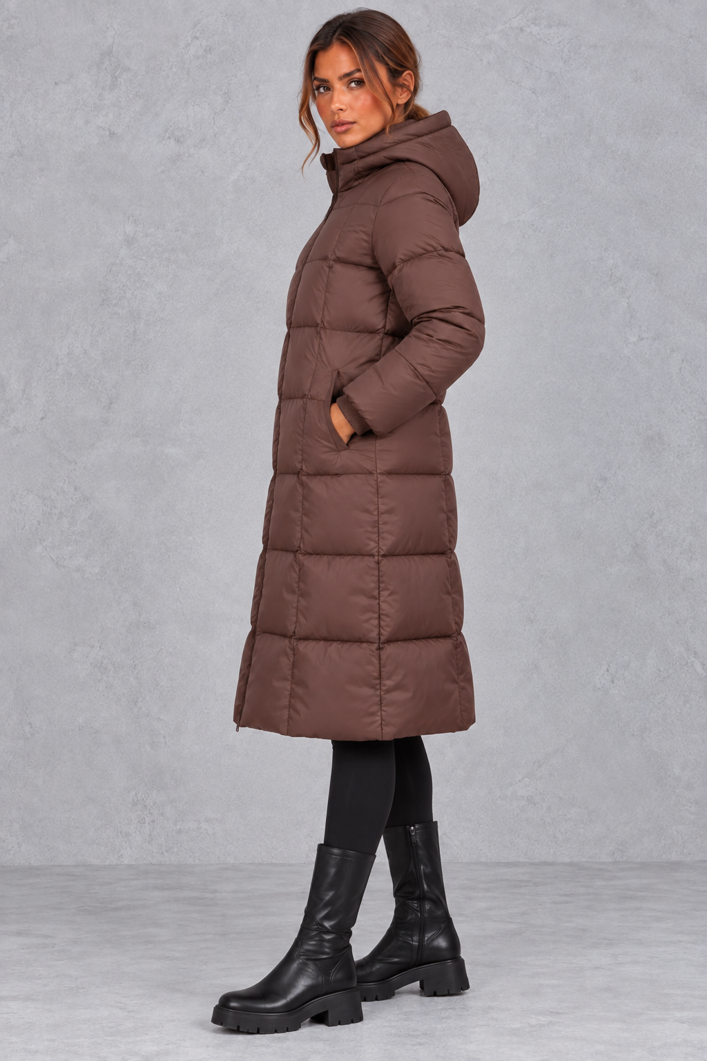 Back view of the longline puffer coat with padded hood