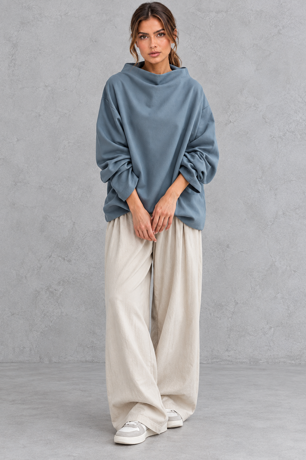 Loose turtleneck sweater styled with jeans