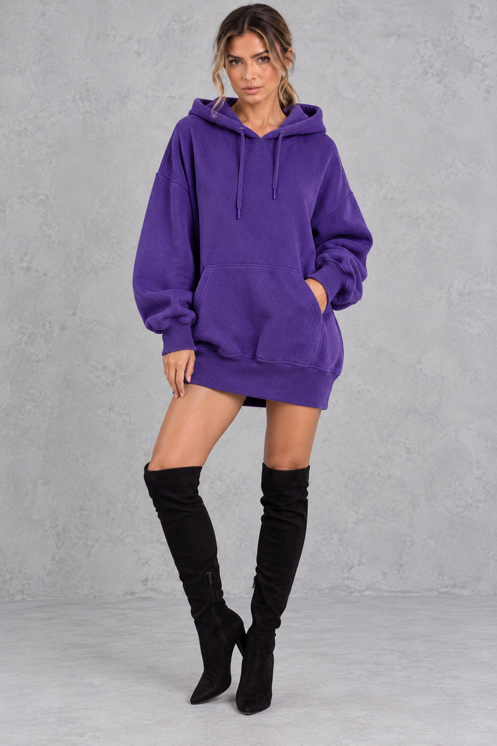 Drawstring hood close-up on a women's oversized hooded mini dress