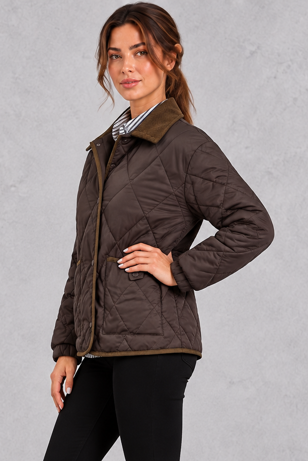 Women's quilted jacket shown from the back with relaxed hip-length cut