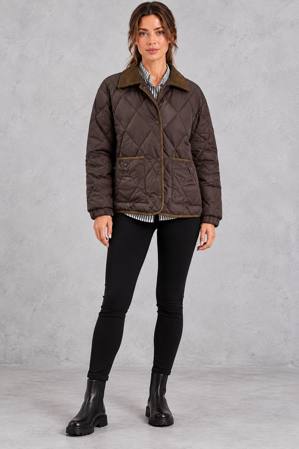 Women's diamond quilted jacket styled with jeans and ankle boots