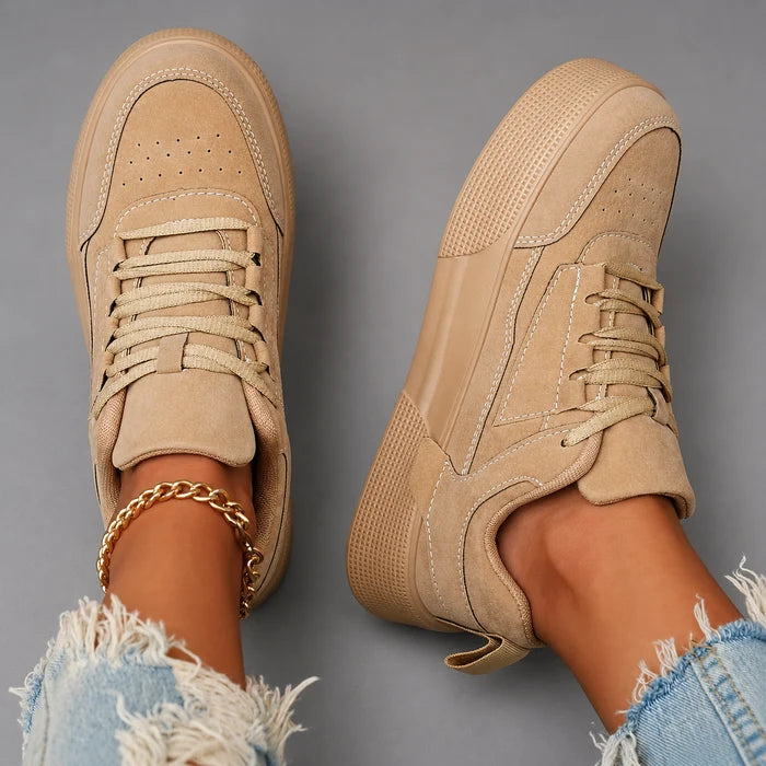 Women’s round toe lace-up sneakers with a lightweight low-top design, cushioned insole, breathable construction, and flexible durable outsole.