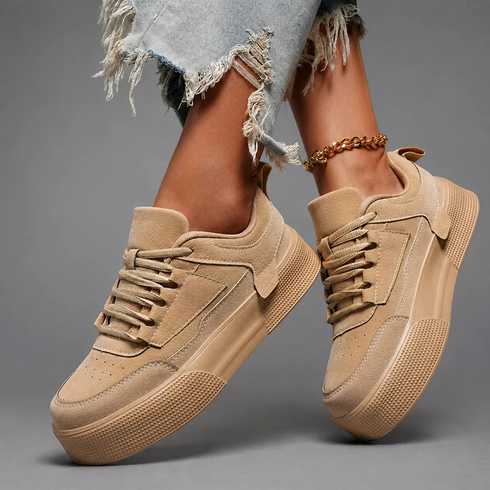 Women’s round toe lace-up sneakers with a lightweight low-top design, cushioned insole, breathable construction, and flexible durable outsole.