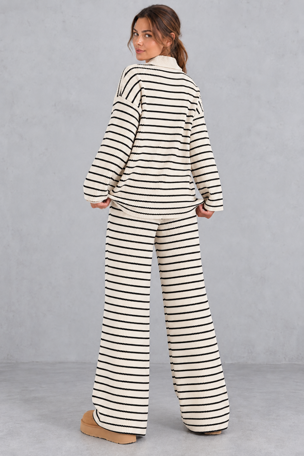 Striped sweater and pants set styled with loafers