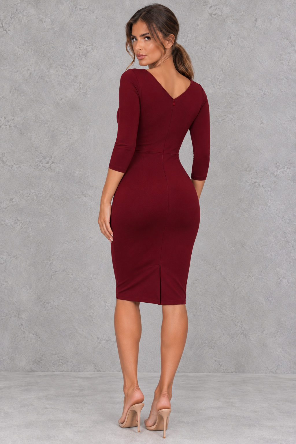 Ruched pencil dress with knee-length skirt in a rich shade, great for fall wedding guests.
