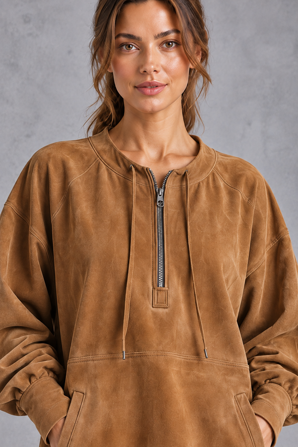 Close-up of the fringe hem and faux suede texture on a women's Western dress