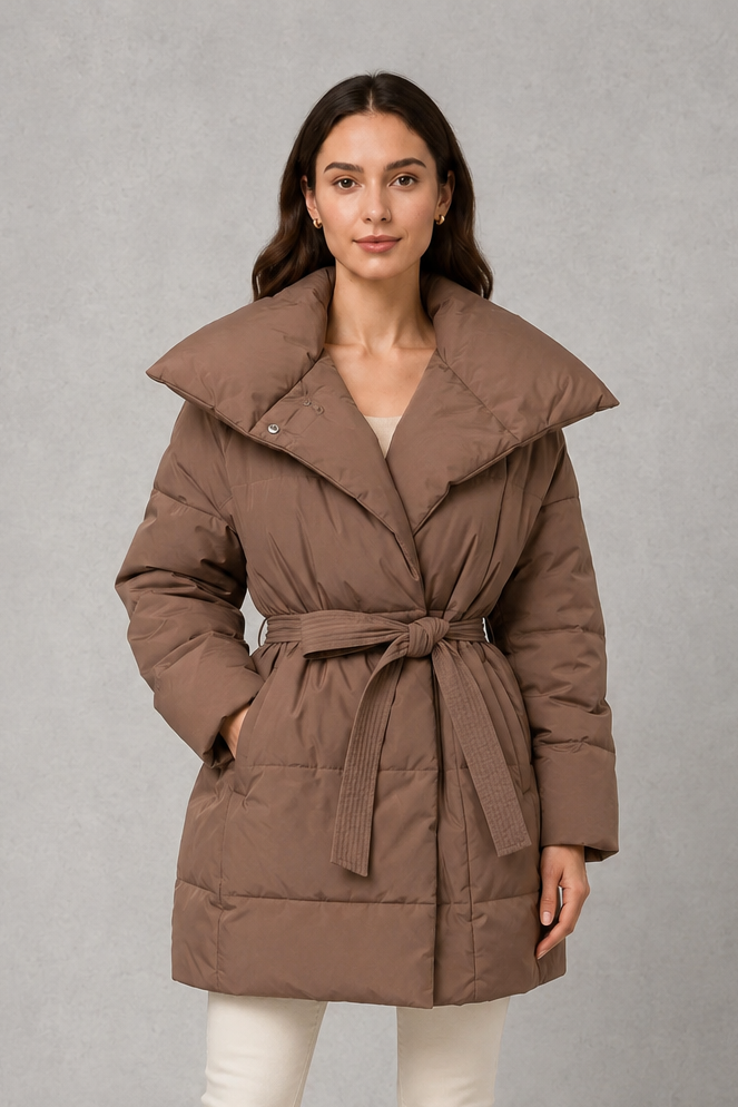 Women’s belted quilted puffer jacket with soft insulated padding, adjustable waist belt, full-length front zipper, and a flattering regular-fit silhouette.