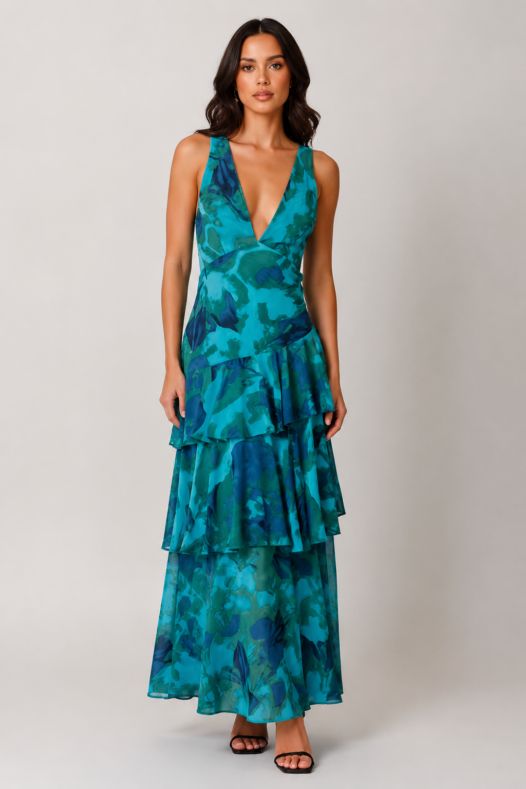 Women's chiffon maxi dress with a V-neckline, tiered ruffle skirt, and flowing silhouette. Lightweight and breathable fabric creates elegant movement, making it suitable for warm-weather events, dinners, and casual outings.