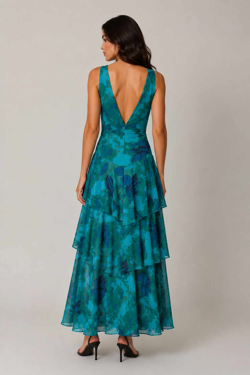 Women's chiffon maxi dress with a V-neckline, tiered ruffle skirt, and flowing silhouette. Lightweight and breathable fabric creates elegant movement, making it suitable for warm-weather events, dinners, and casual outings.