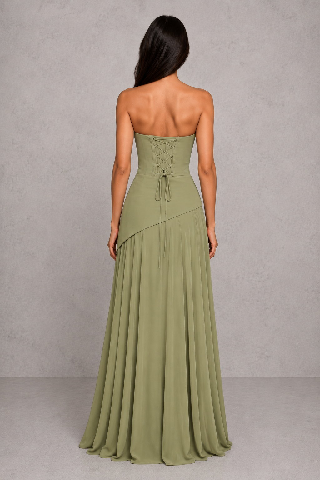 Women's chiffon maxi dress with a pleated cowl neckline, structured boned bodice, asymmetric waist detailing, lace-up back, and flowing multi-godet skirt for elegant evening and formal occasions.