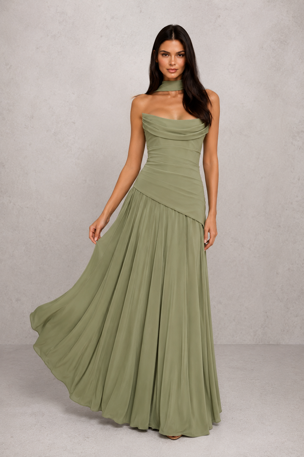 Women's chiffon maxi dress with a pleated cowl neckline, structured boned bodice, asymmetric waist detailing, lace-up back, and flowing multi-godet skirt for elegant evening and formal occasions.