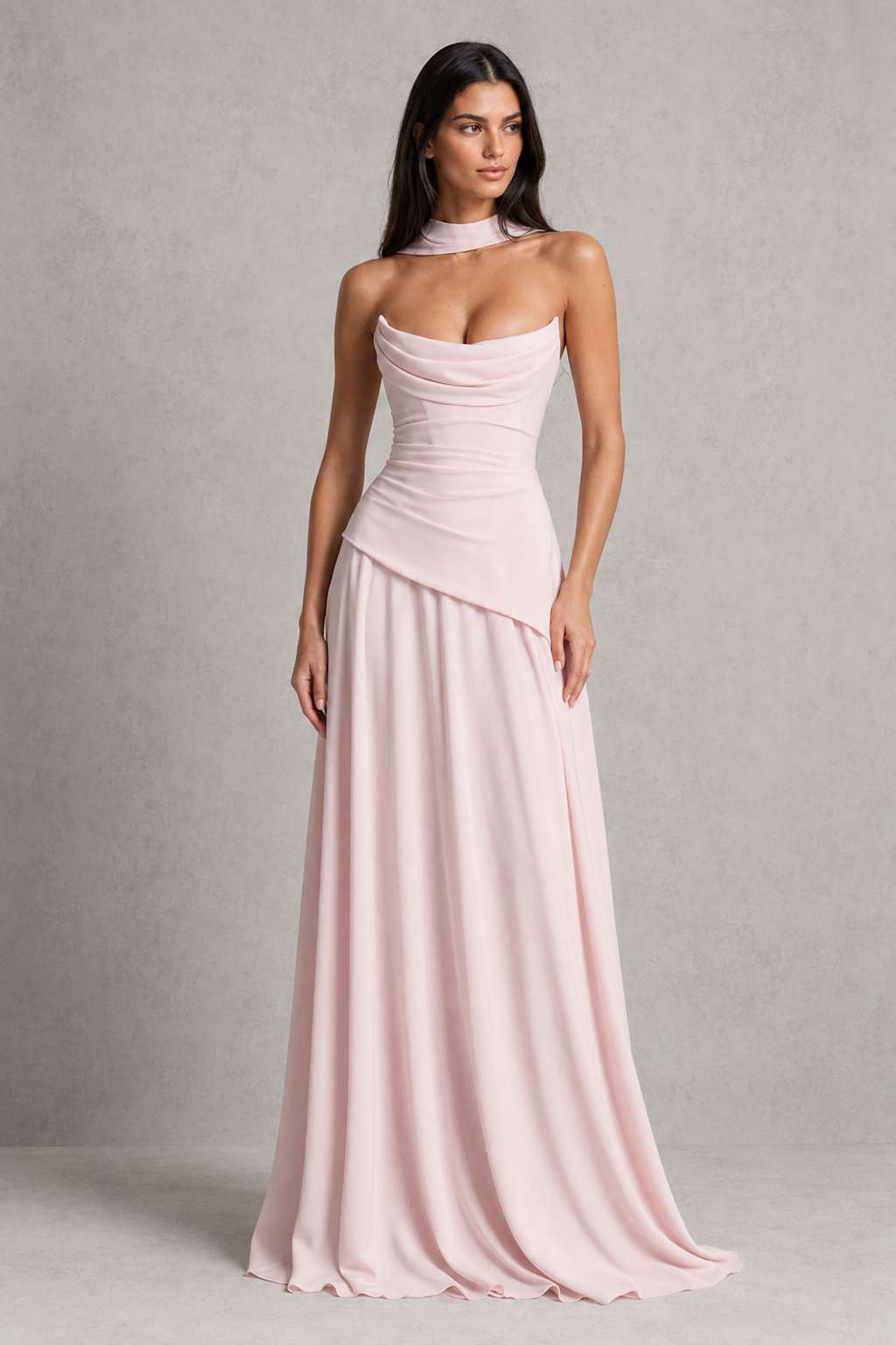 Women's chiffon maxi dress with a pleated cowl neckline, structured boned bodice, asymmetric waist detailing, lace-up back, and flowing multi-godet skirt for elegant evening and formal occasions.