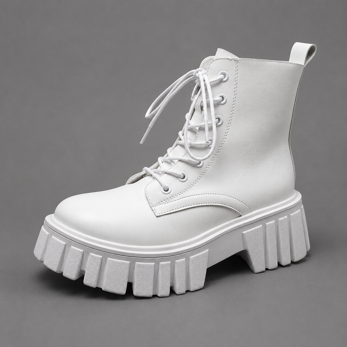 Women’s chunky combat ankle boots with lace-up front, round toe, leather-look PU upper, block heel, and rugged lug sole.