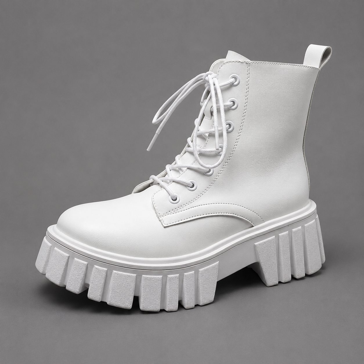 Women's chunky sole combat boots with a lace-up design, ankle-height silhouette, square heel and durable rubber sole for everyday casual wear.