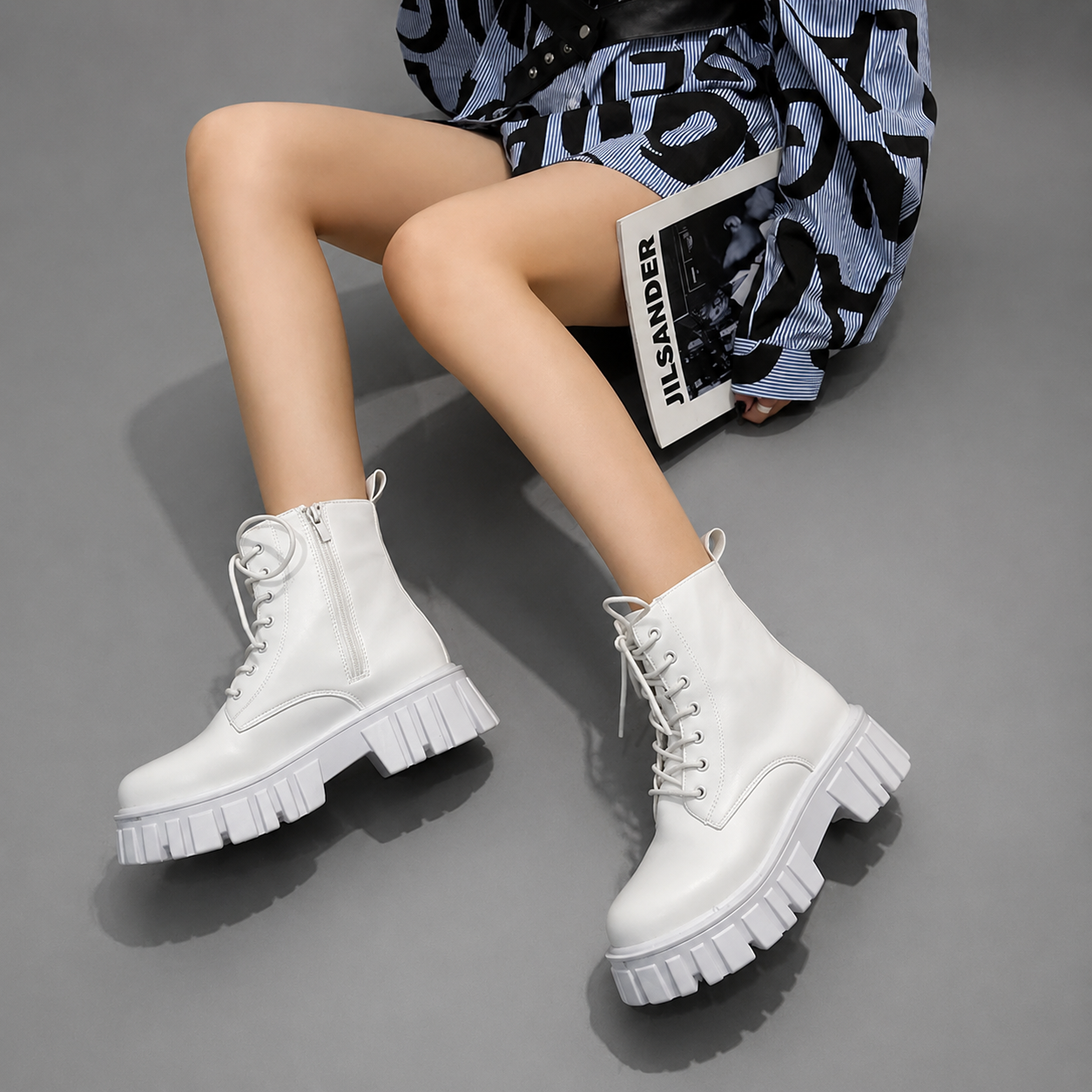 Women's chunky sole combat boots with a lace-up design, ankle-height silhouette, square heel and durable rubber sole for everyday casual wear.
