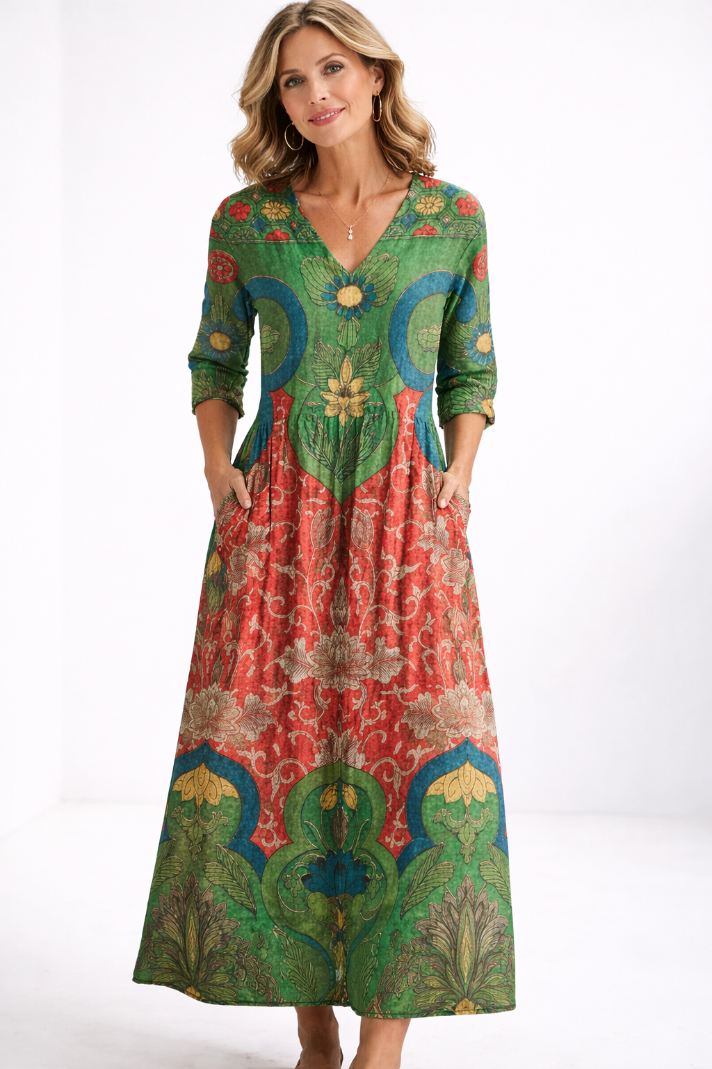 Woman wearing a colorful patterned dress on a white background