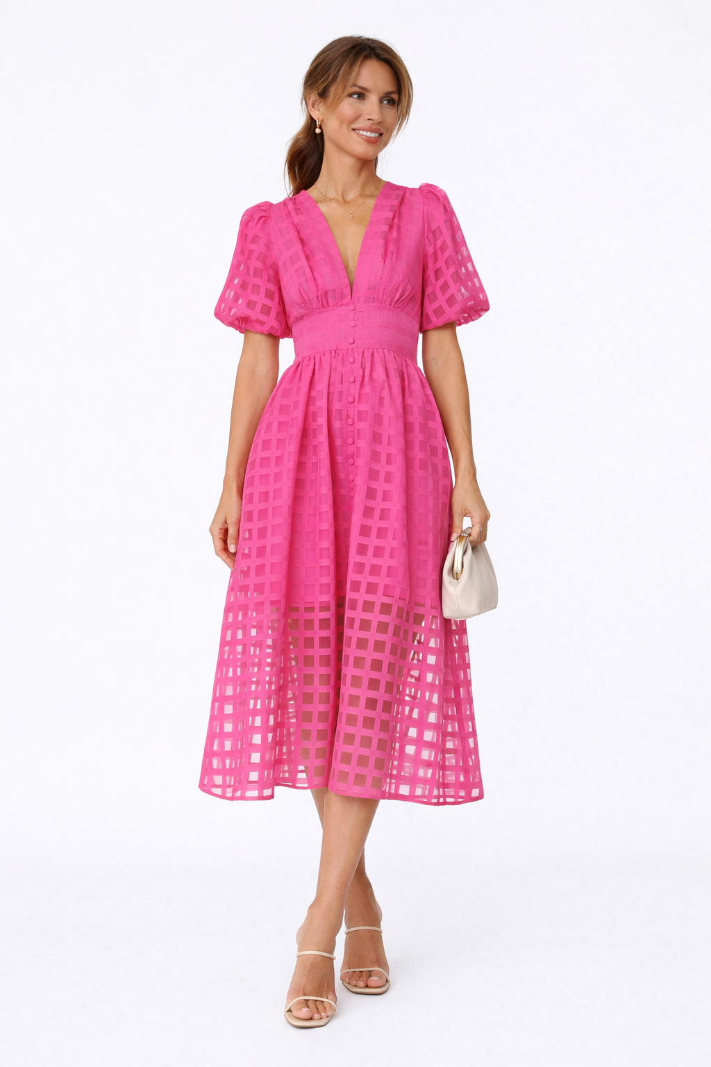 Woman wearing a pink dress with a white background