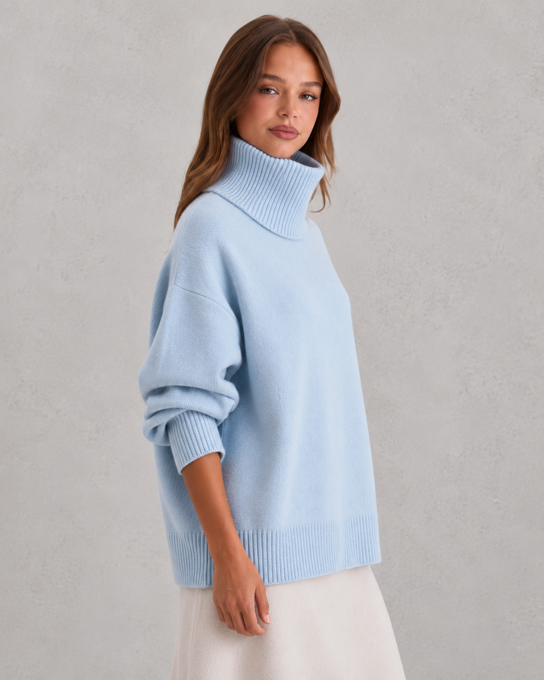Women's cozy knitted turtleneck sweater in a relaxed, feminine silhouette with a softly structured fit. Features a refined high neckline, rich textured knit, and clean minimalist design that offers warmth and breathable comfort. A versatile wardrobe essential styled effortlessly with tailored trousers, denim, boots, or accessories for polished everyday wear from office settings to casual outings.