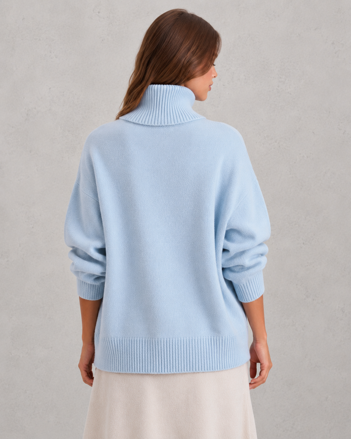 Women's cozy knitted turtleneck sweater in a relaxed, feminine silhouette with a softly structured fit. Features a refined high neckline, rich textured knit, and clean minimalist design that offers warmth and breathable comfort. A versatile wardrobe essential styled effortlessly with tailored trousers, denim, boots, or accessories for polished everyday wear from office settings to casual outings.