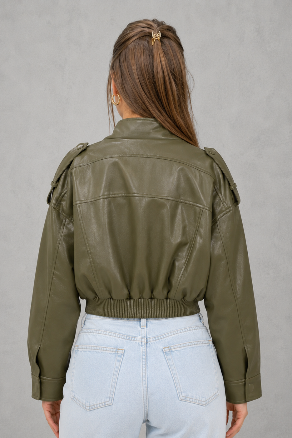 Women’s cropped faux leather bomber jacket with zip-front closure, functional pockets, ribbed cuffs and hem, and a relaxed leather-look finish.