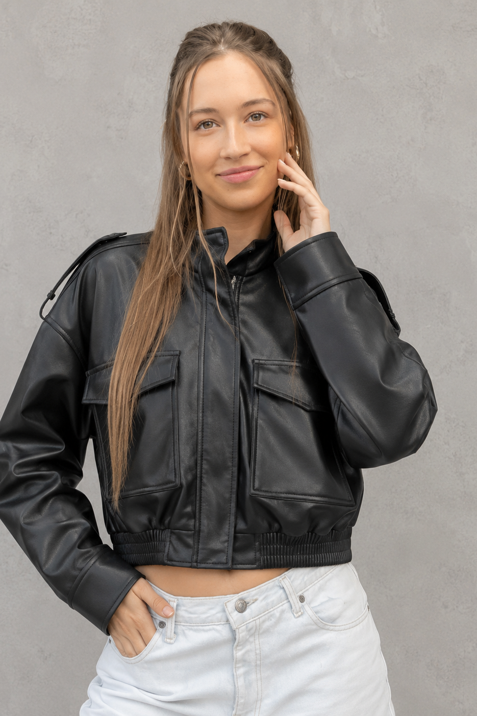 Women’s cropped faux leather bomber jacket with zip-front closure, functional pockets, ribbed cuffs and hem, and a relaxed leather-look finish.