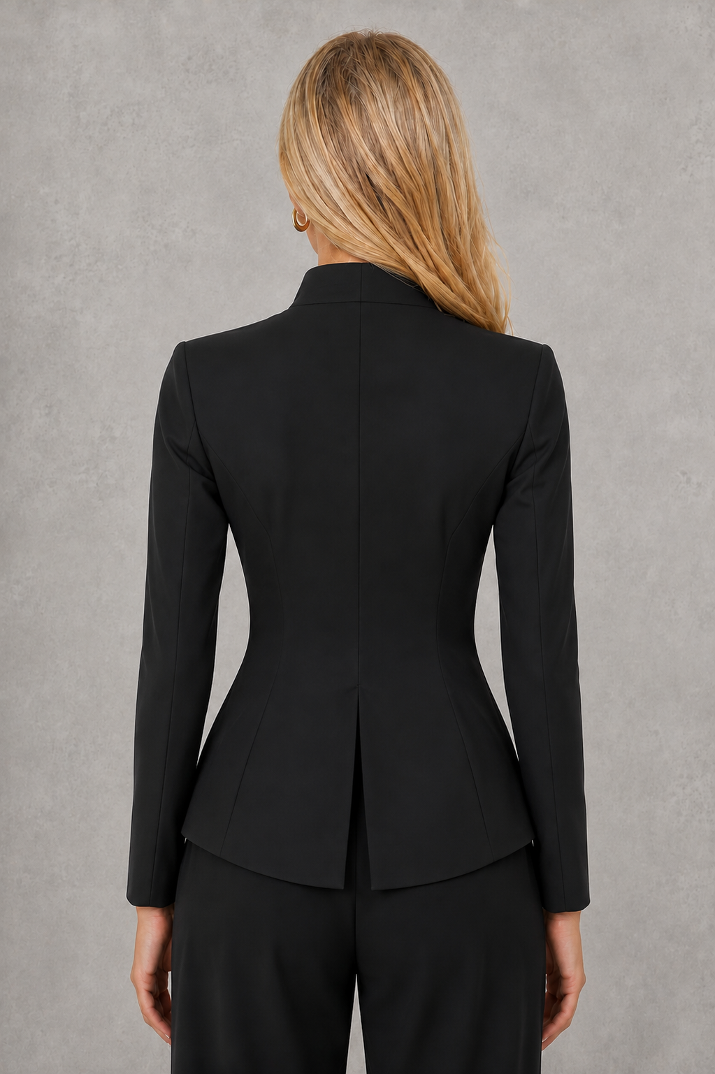Women’s cutout high-neck blazer with structured shoulders, sculpted fitted waist, statement front cutout, and long sleeves with slit cuffs.