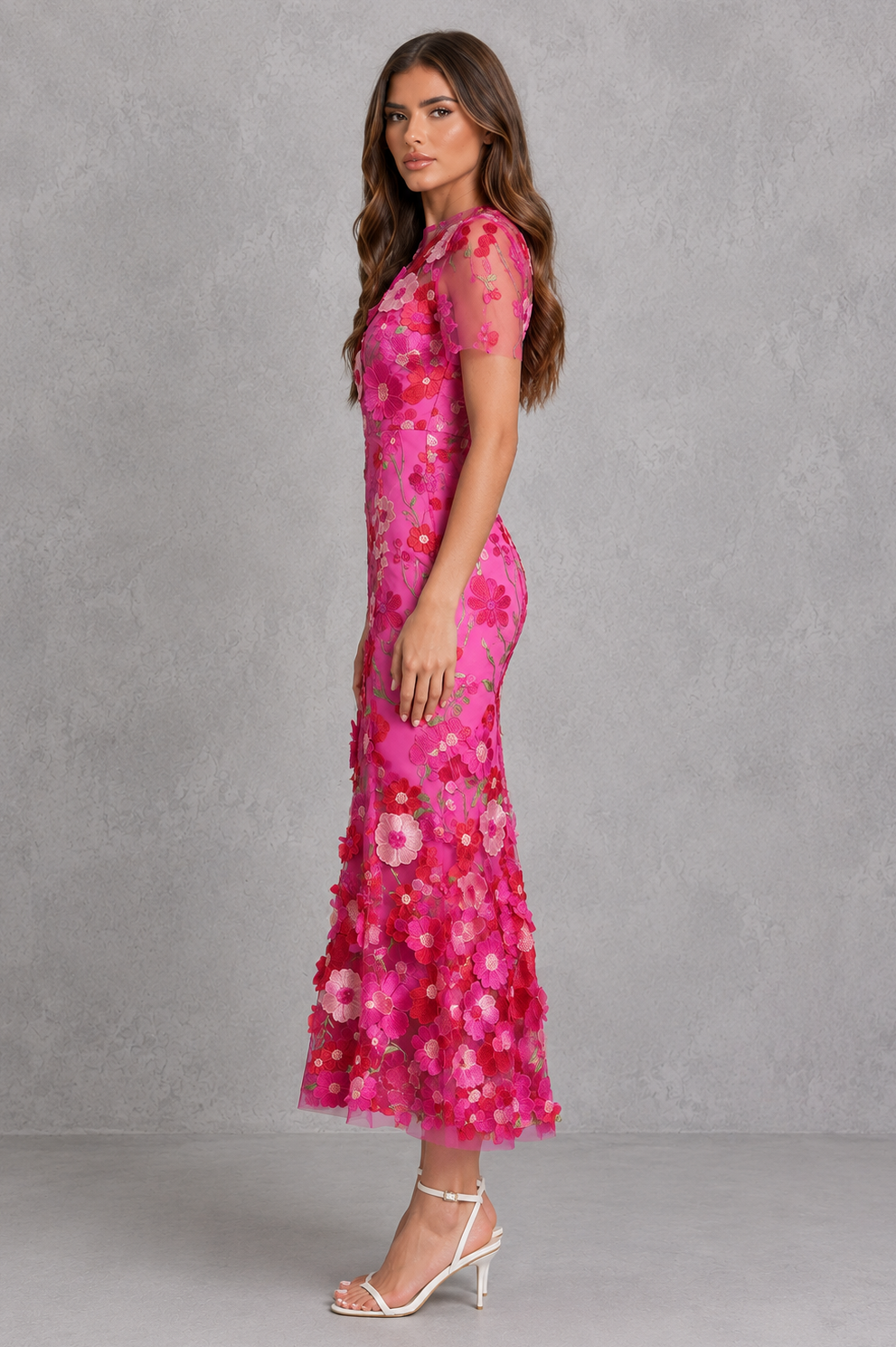 Women’s floral appliqué midi dress with elegant high neckline, sheer long sleeves, fitted silhouette and flared hem for wedding and occasion wear.