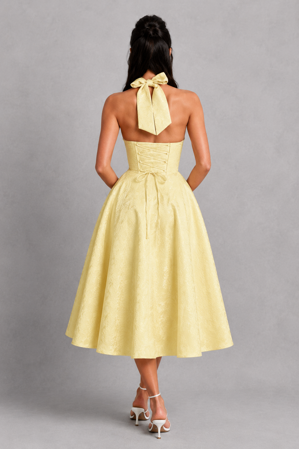 Women's floral jacquard halter midi dress with a structured boned corset bodice, plunge neckline, lace-up back, and full tulle-lined skirt, designed for elegant party wear, weddings, and special occasions.
