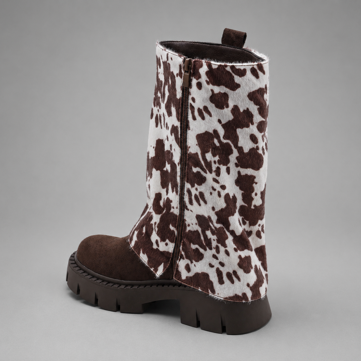 Women’s genuine leather knee-high biker boots with a supple leather upper, long external zipper, double buckle accents, and sturdy sole.