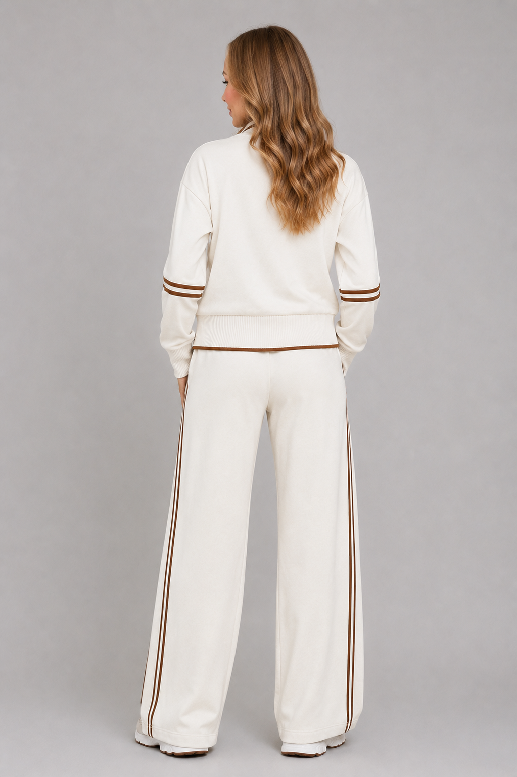 Women’s half-zip lounge set with a relaxed funnel-neck sweatshirt, contrast stripe detailing, and matching wide-leg drawstring pants.