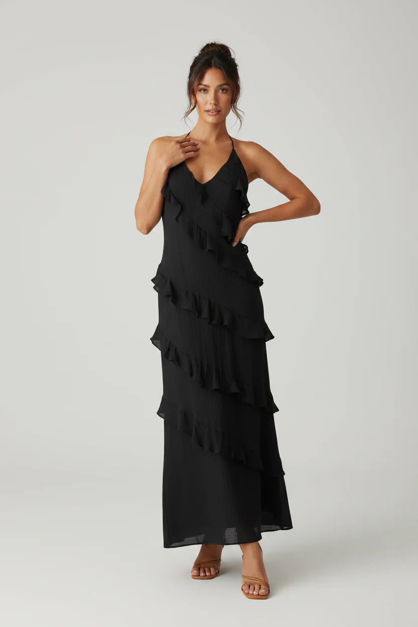 Womenโs halter neck ruffle maxi dress with a flowing full-length silhouette, soft ruffle detailing, and a figure-skimming bodice. Lightweight breathable fabric creates elegant movement, making it ideal for evening events, special occasions, and holiday wear.