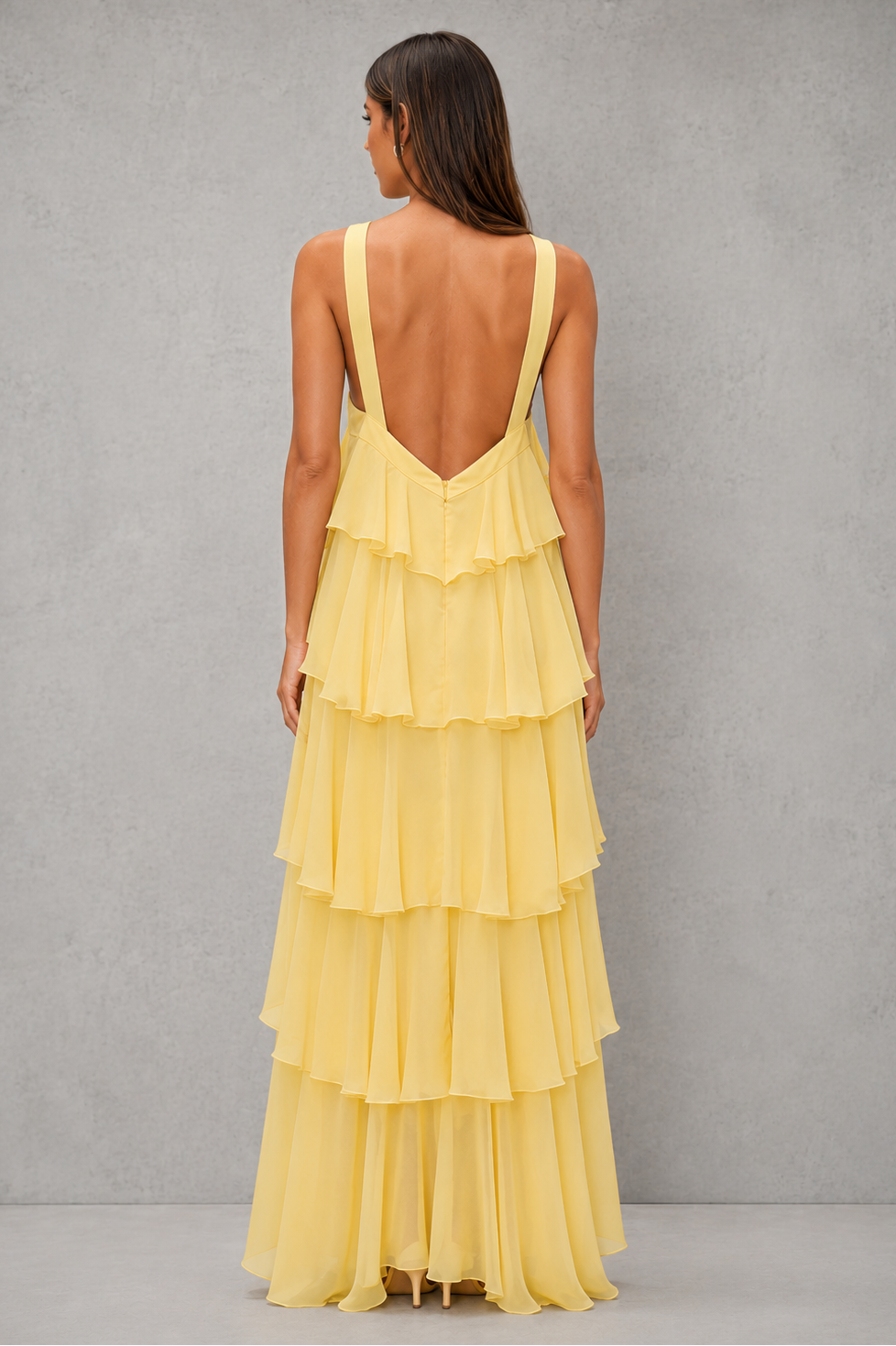 Womenโs butter yellow halter chiffon maxi dress with 3D floral rosette, asymmetrical tiered skirt and flowing silhouette for weddings and evening wear.