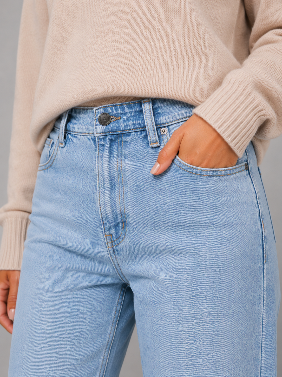 Women’s high-waisted wide-leg jeans with a light wash, high-rise waist, relaxed straight legs, five-pocket design, and classic button-and-zip closure.