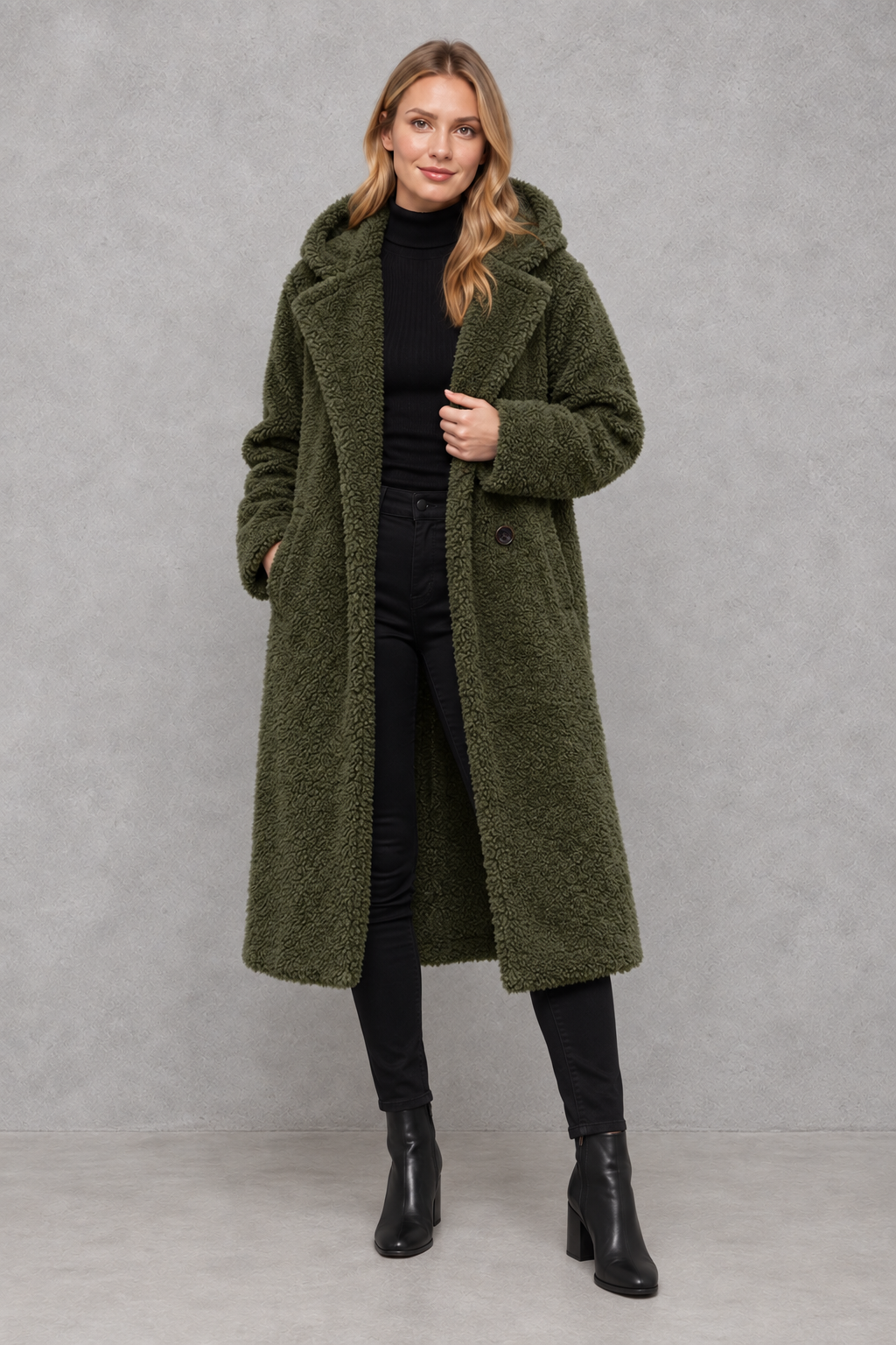 Women’s hooded quilted longline coat with soft insulated padding, a relaxed silhouette, protective hood and deep side pockets.