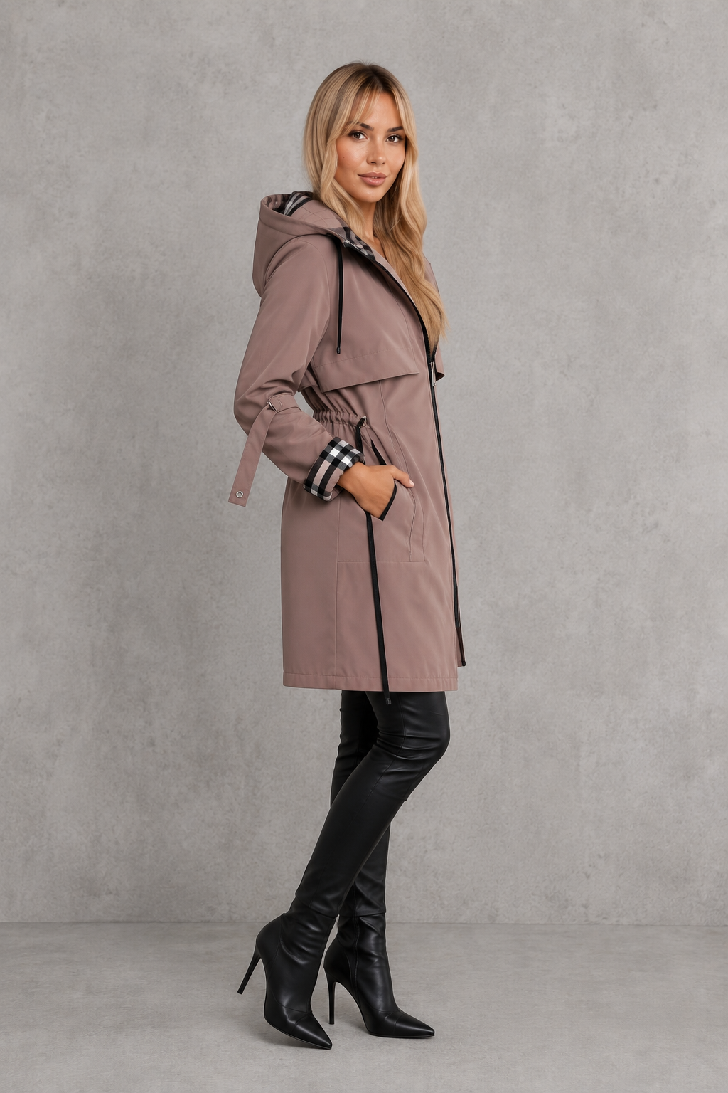Women’s hooded waterproof rain jacket with a lightweight windproof design, full front zipper, soft lining, and flattering tailored silhouette.