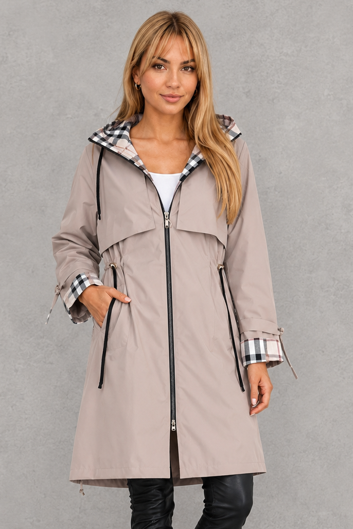Women’s hooded waterproof rain jacket with a lightweight windproof design, full front zipper, soft lining, and flattering tailored silhouette.