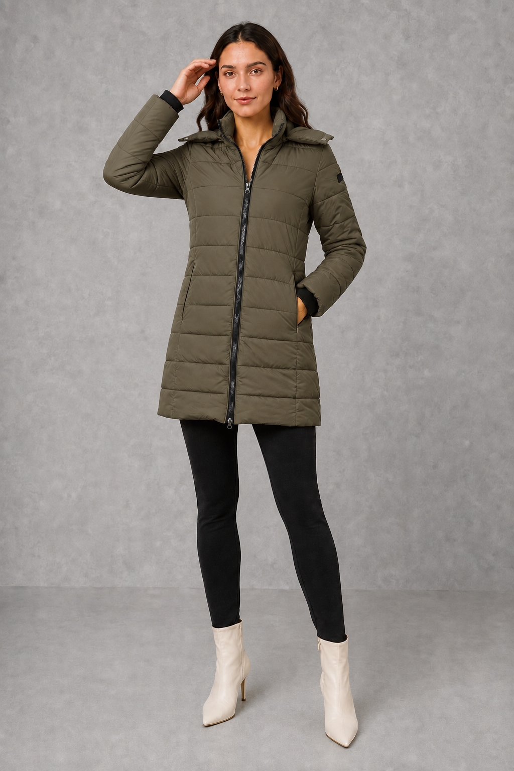 Women’s insulated hooded puffer coat with lightweight padding, protective hood, full-length front zipper, and a streamlined silhouette for cold-weather wear.