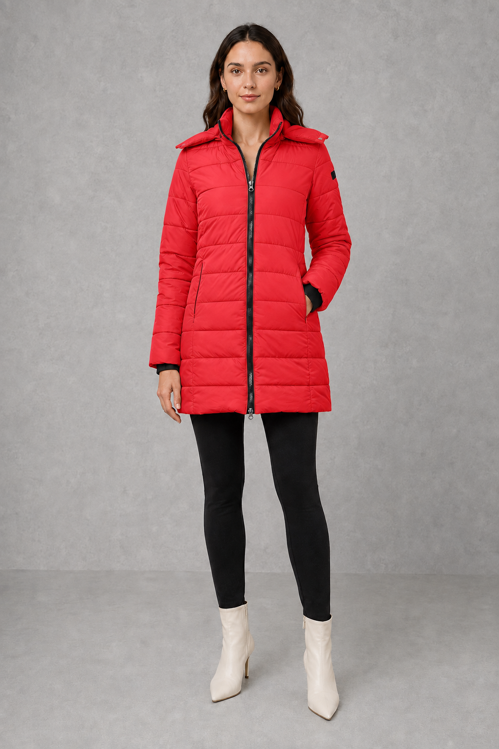 Women’s insulated hooded puffer coat with lightweight padding, protective hood, full-length front zipper, and a streamlined silhouette for cold-weather wear.