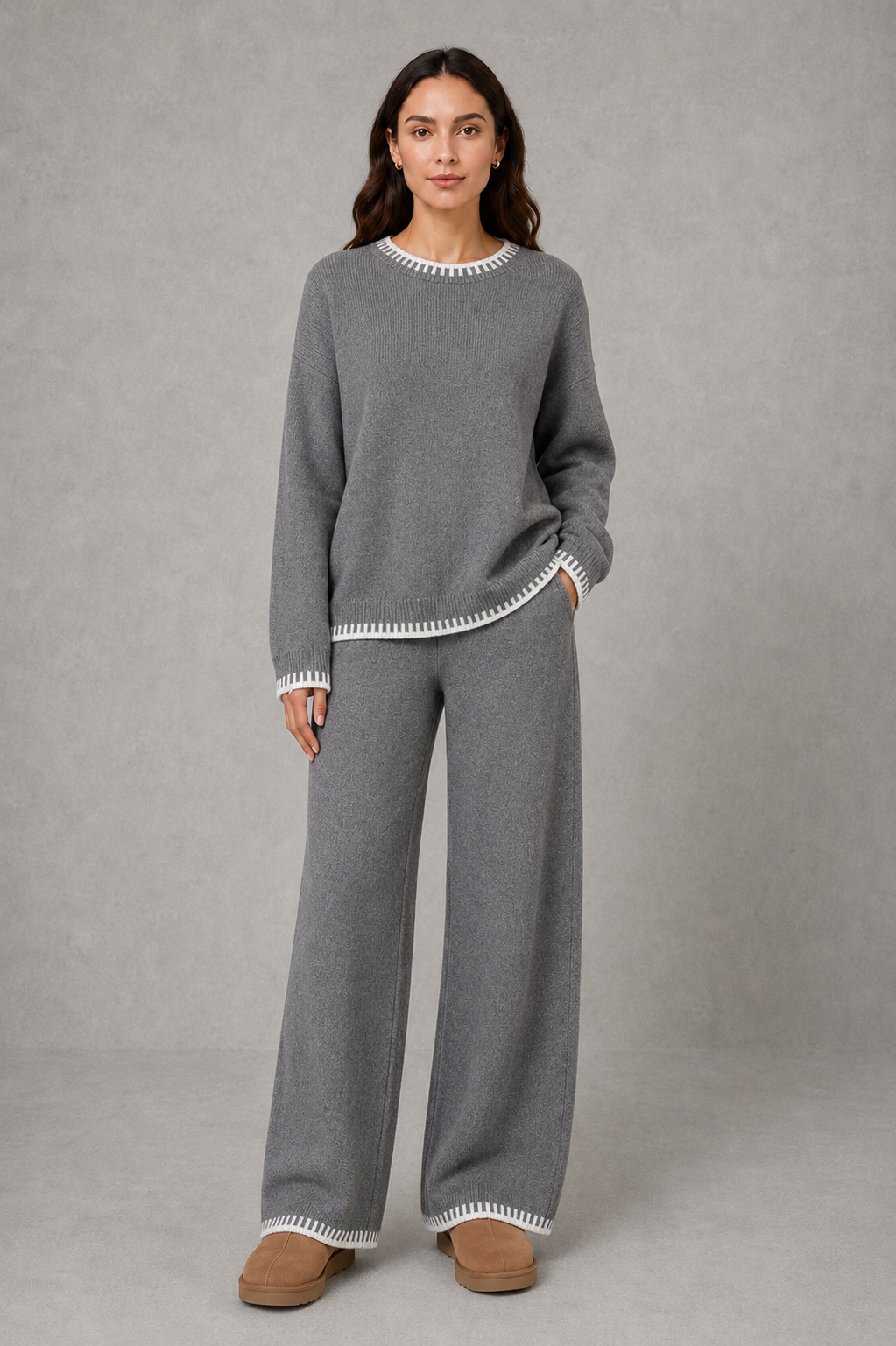 Women’s two-piece knit set featuring a relaxed crew-neck sweater with contrast trim and matching wide-leg knit pants.